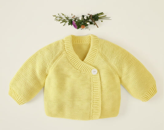 Cache-coeur bébé Myrte à tricoter.